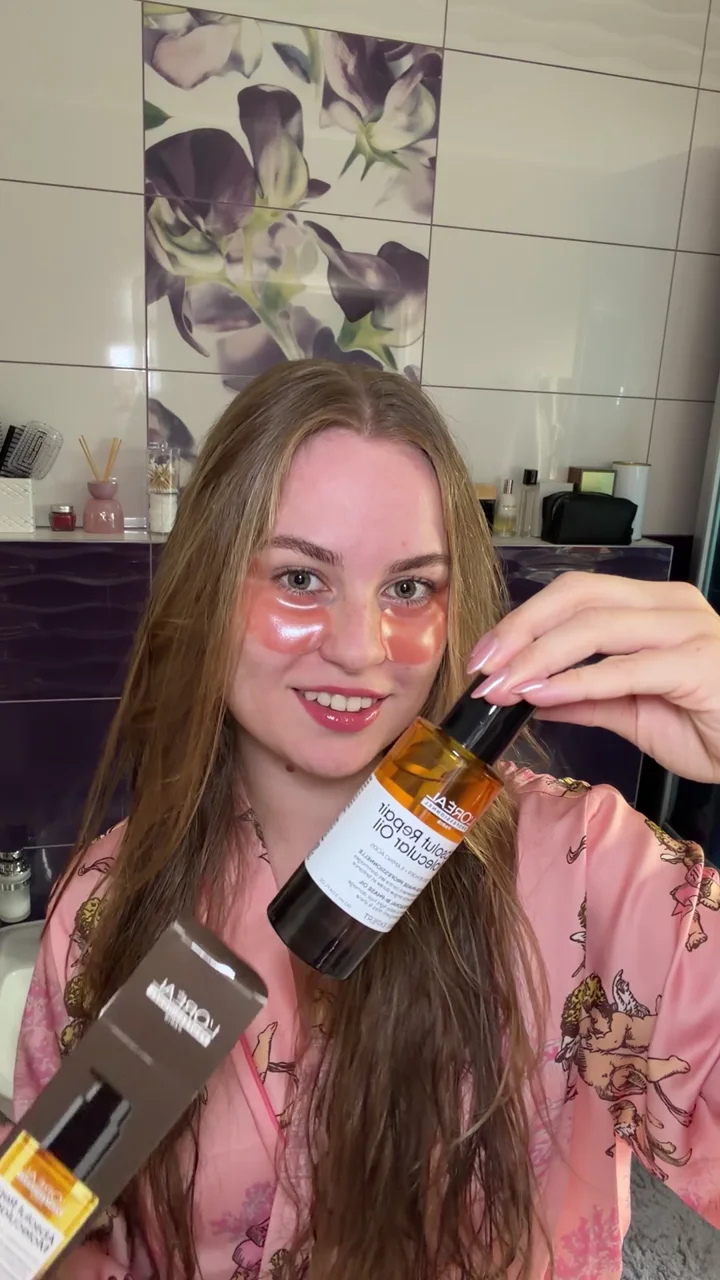 Sofiya demonstrating L'Oréal Professionnel Absolut Repair Molecular hair oil